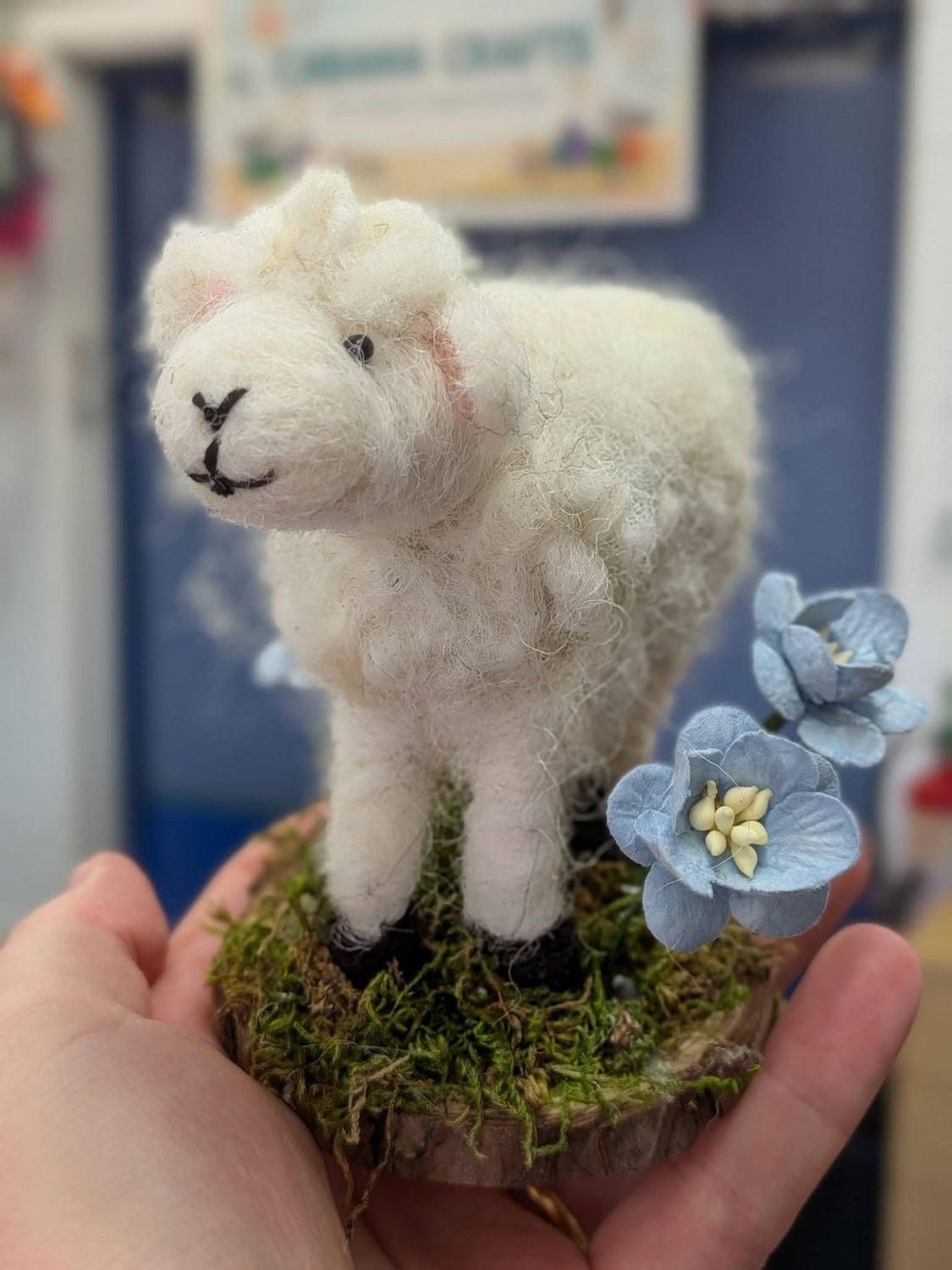 Hand-felted sheep with paper flowers