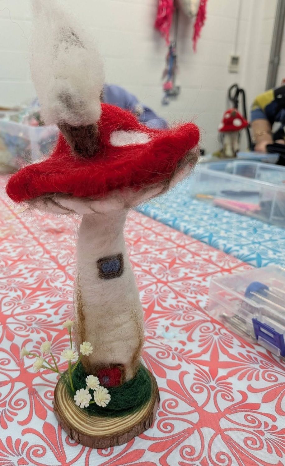 Needle-felted toadstool cottage